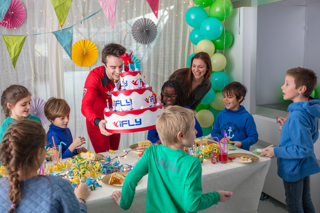 Kids birthday with instructor with cake